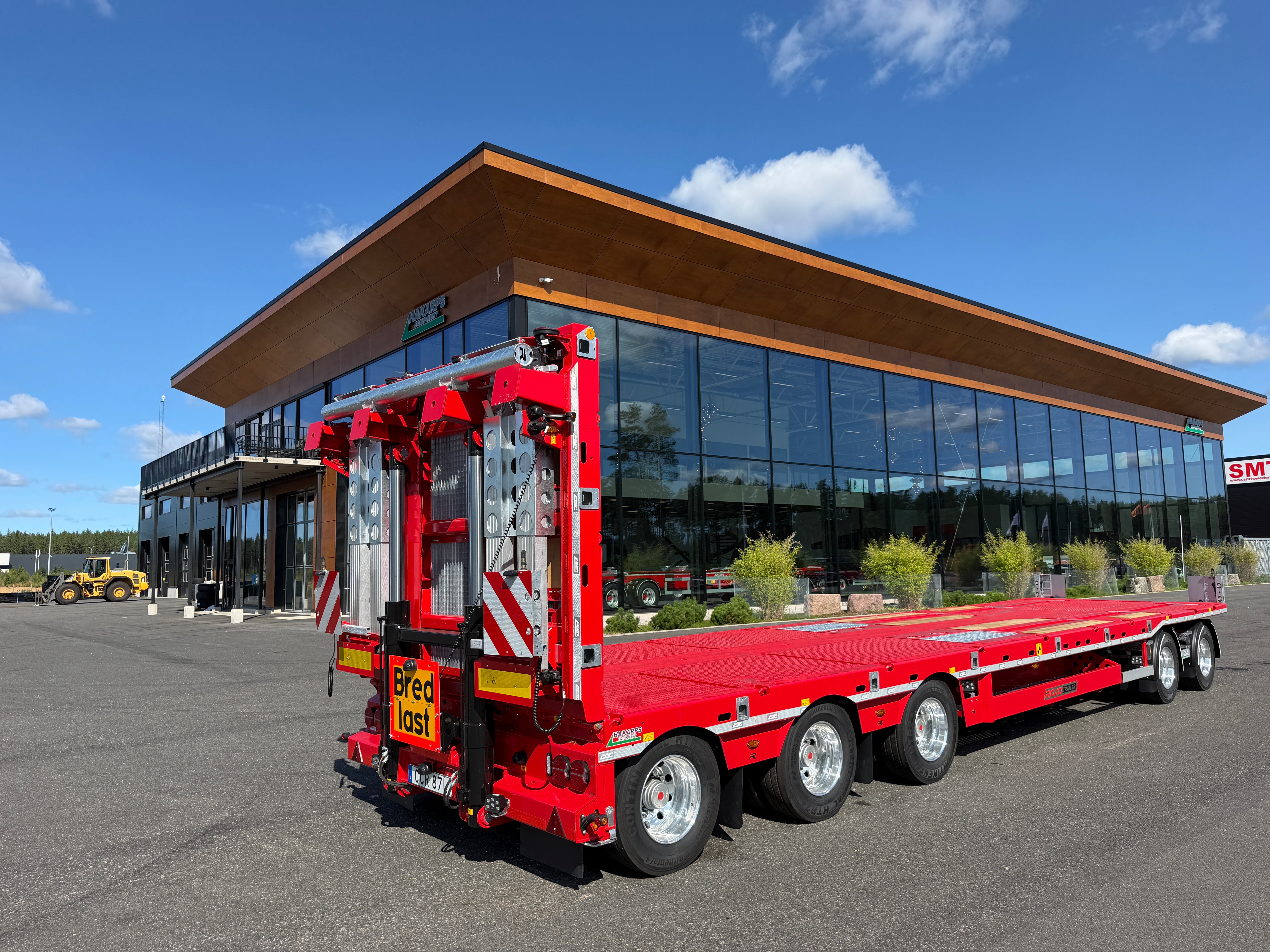 5 axlad 42 tons plan maskinvagn med uppvikbar ramp