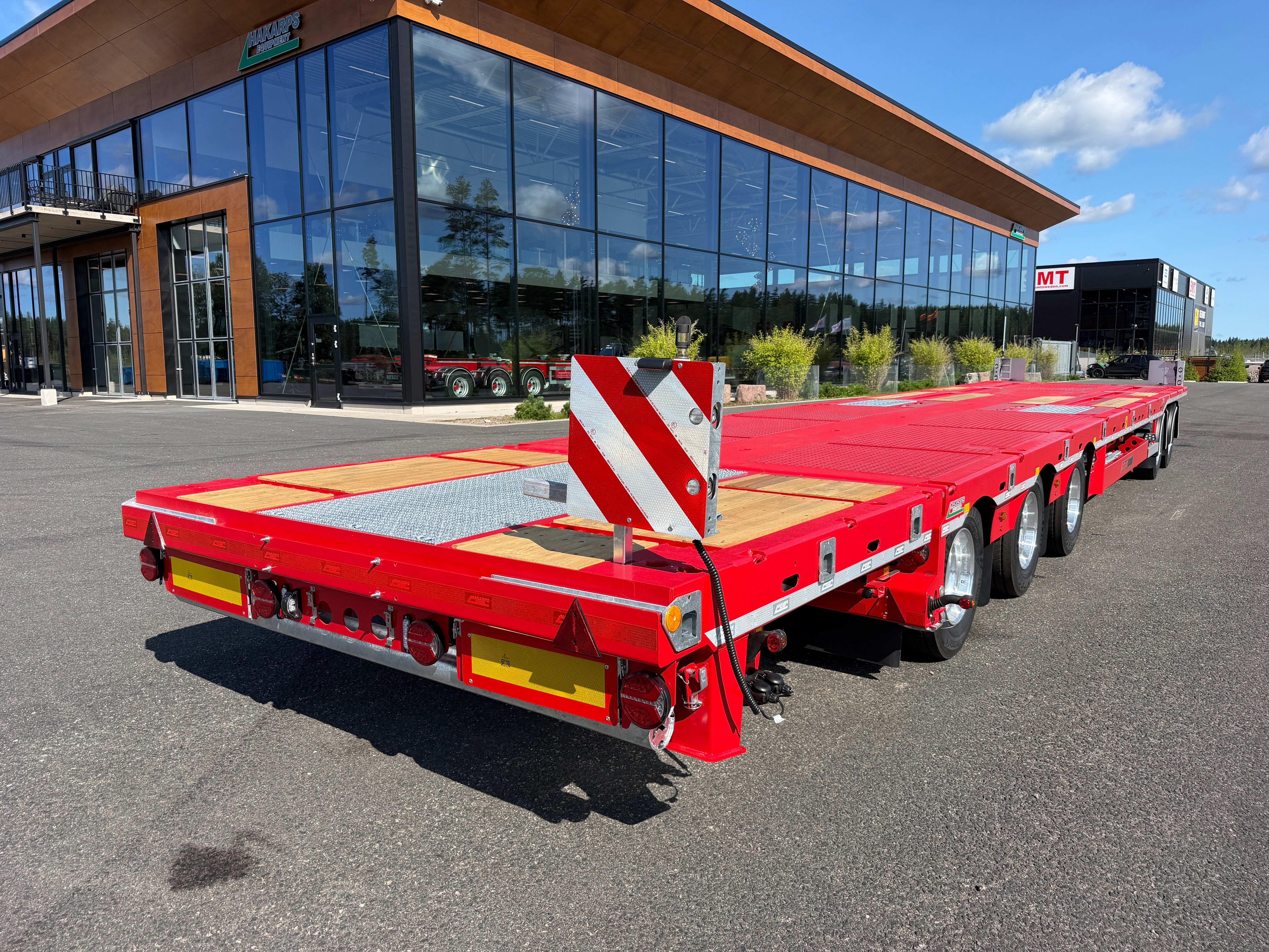 5 axlad 42 tons plan maskinvagn med uppvikbar ramp